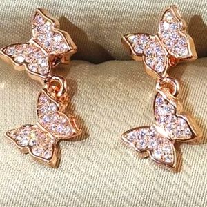 ROSE GOLD BUTTERFLY DANGLE EARRINGS ONE AND A HALF INCH ENCRUSTED WITH WHITE TOP